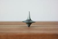 A spinning top on a table