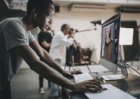 Person checking a film shot on a monitor