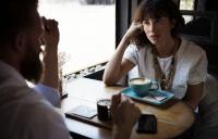 A photo of a man and a woman drinking coffee