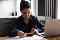 Woman works on tax return at a desk