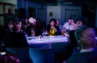 A photo of people sitting around a table