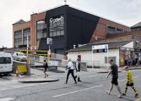 Photo of exterior of arts centre with car park entrance