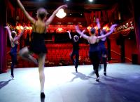 Photo of dancers rehearsing on stage