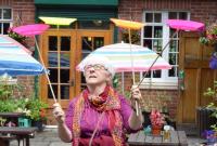 A woman spinning plates