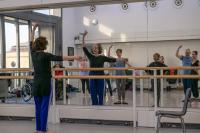 Dancers facing a mirror in the Clore Studio