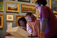 Children viewing an exhibit in a museum