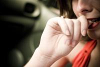 Photo of person biting nails