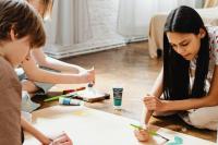 Young people working together on a piece of artwork