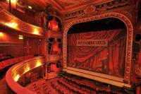 The interior of Theatre Royal Stratford East showing the stage with the safety iron down