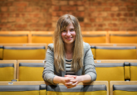 Elizabeth Newman sits in an auditorium