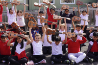 Pupils at Hallsville Primary School hold their ukuleles