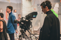 A young producer works on film set