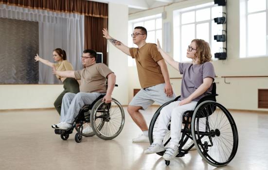 Four people dancing In a studio