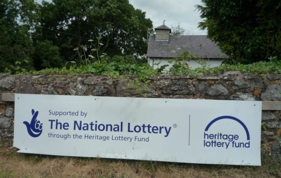 A National Lottery sign outside a heritage site