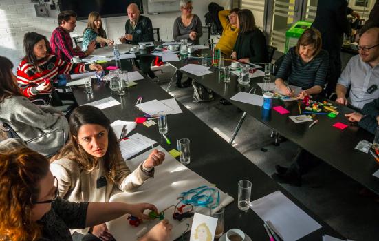 Photo of people sitting round table