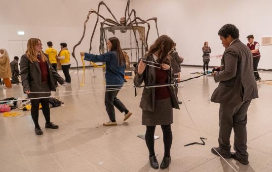 Images of school pupils with a lousie bourgeois sculpture