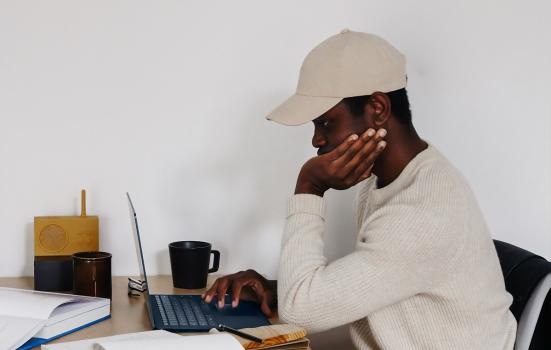 Man sitting at a laptop