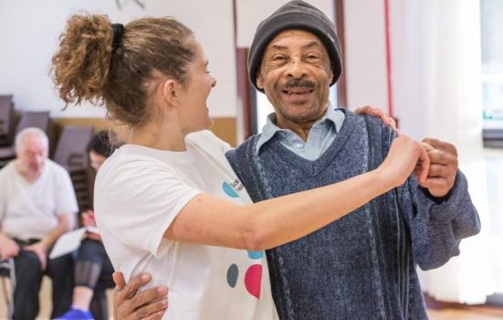 Photo of woman in dance hold with older man