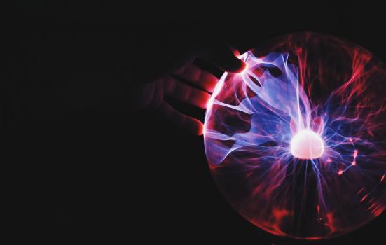 Hand on plasma ball lamp