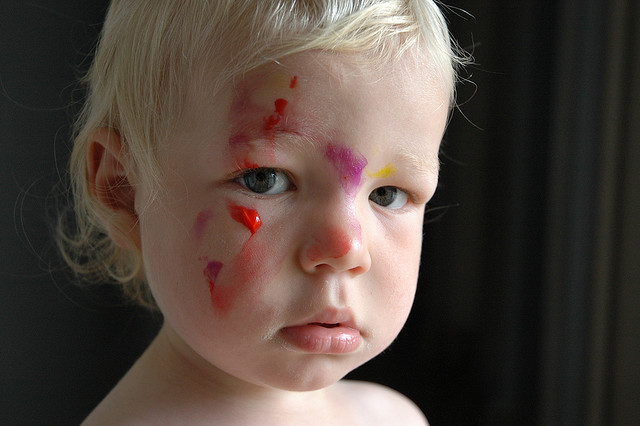 Photo of a child with paint on his face