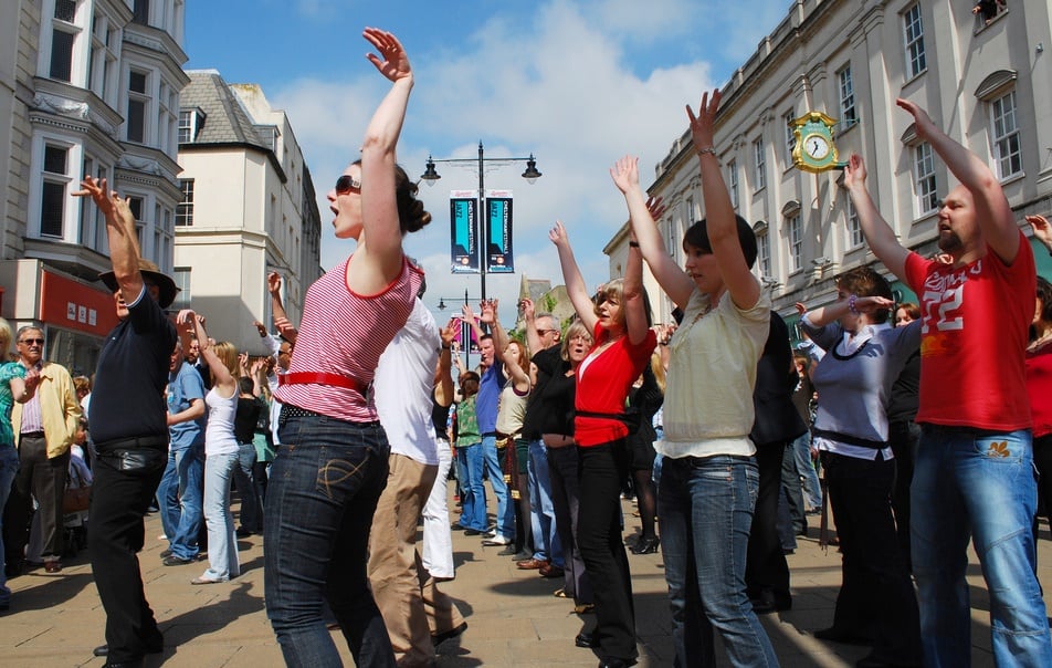 Photo of people dancing in the street