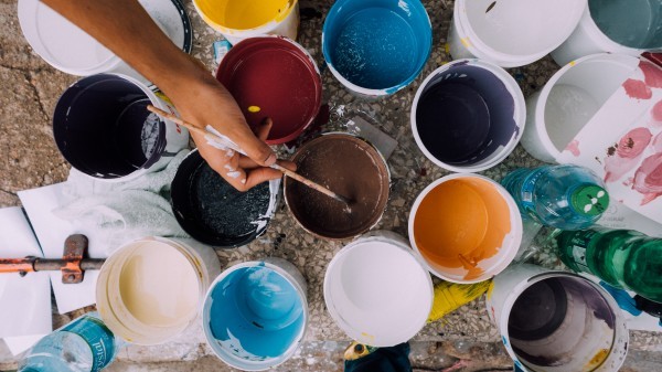 Dipping a brush in a paint pot