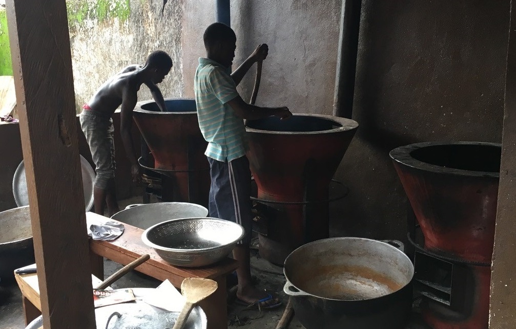 Photo of children stirring big pots