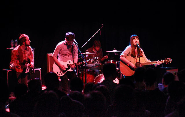 Photo of band playing on stage