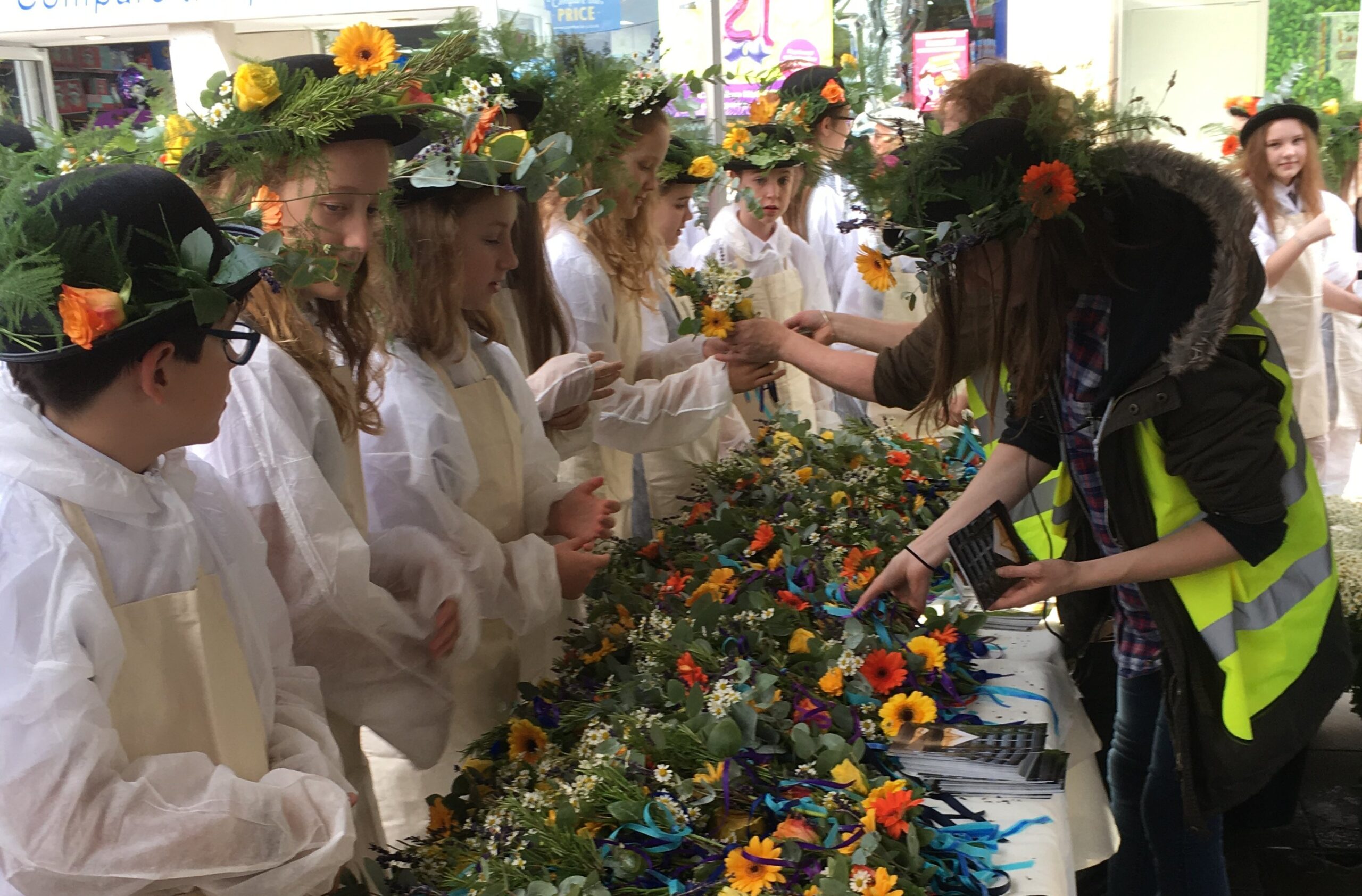 Photo of children with flowery hats