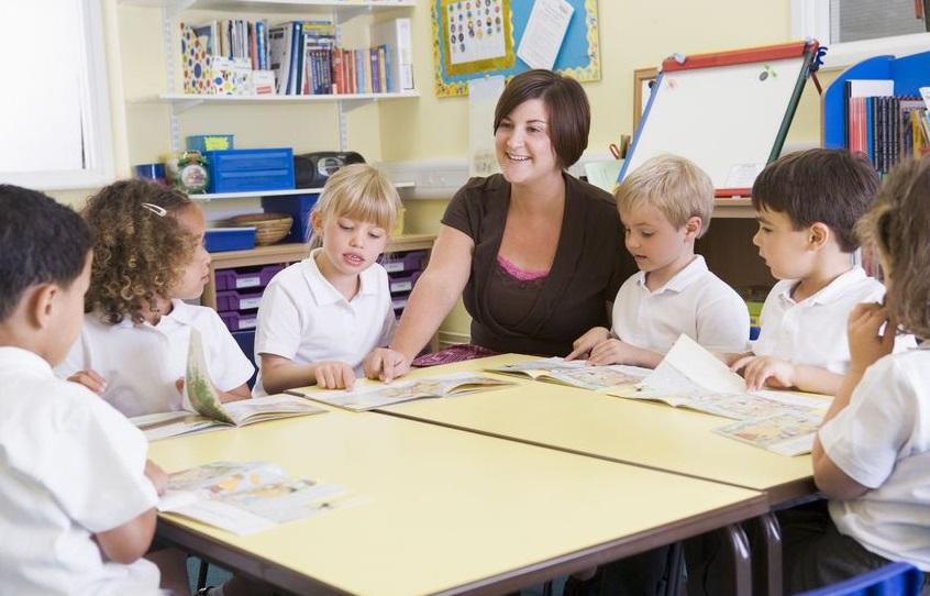 Photo of teacher and pupils