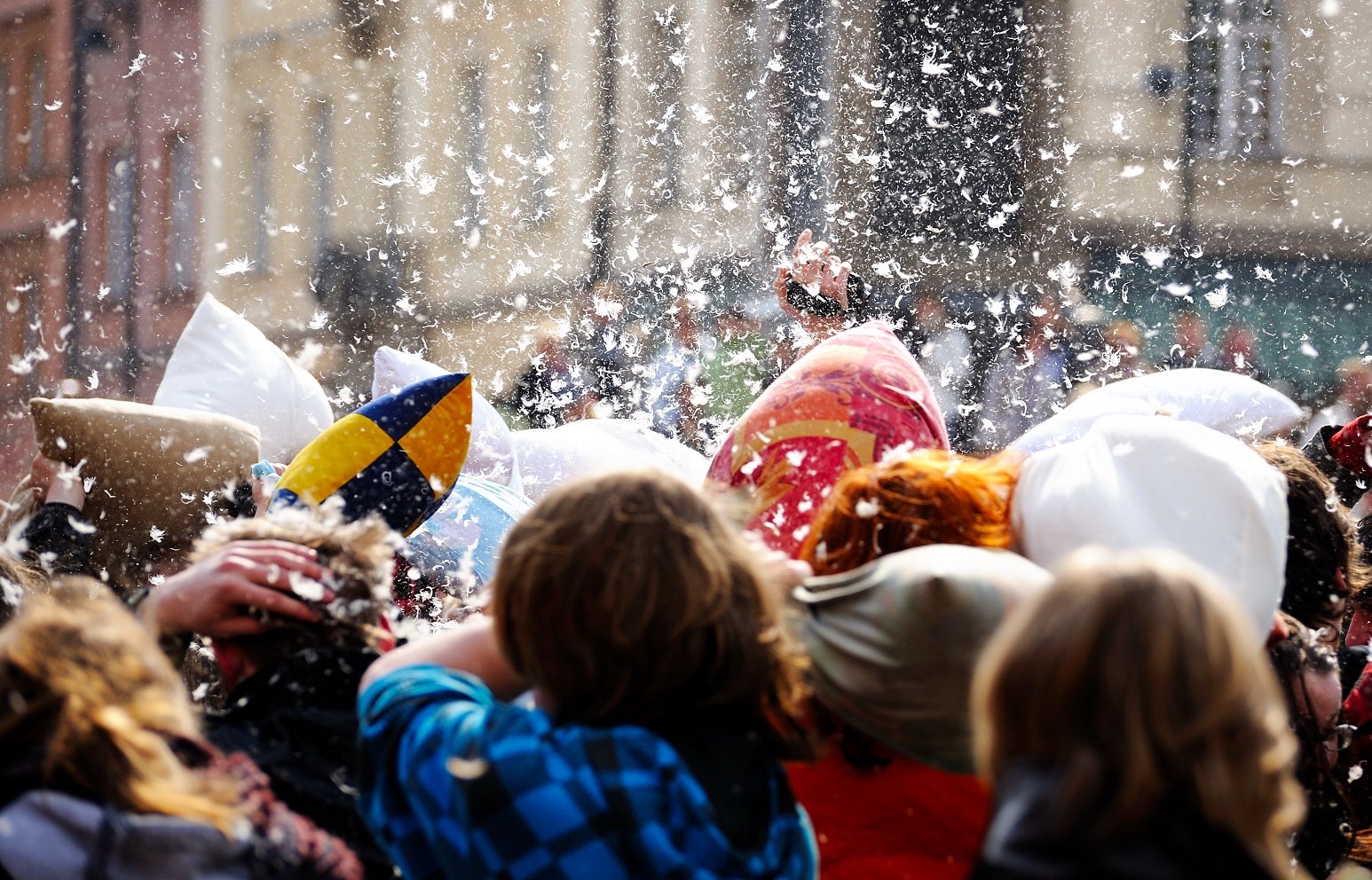 Photo of people in street pillow fight