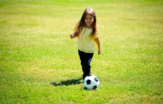 Girl playing football