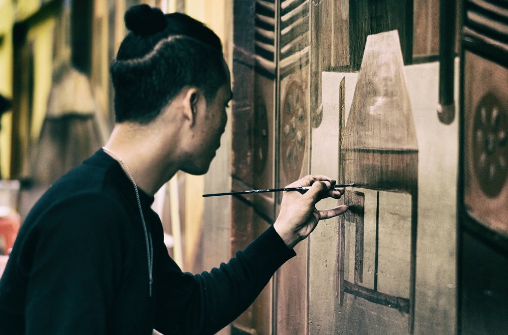 Photo of artist painting