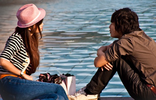 Photo of teens by a fountain