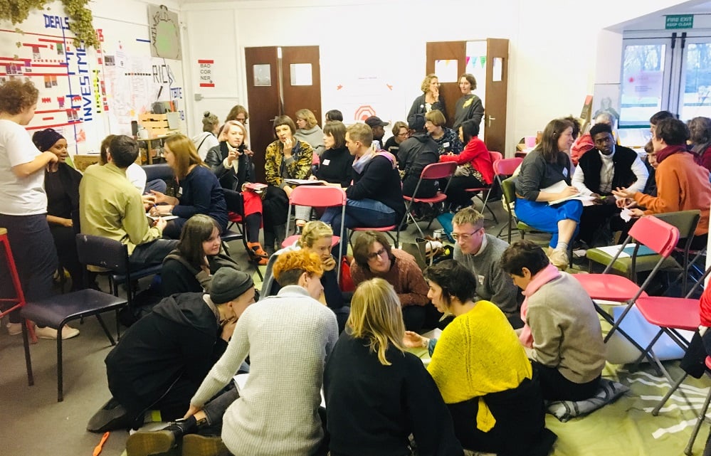 A photo of groups of people sitting in a room