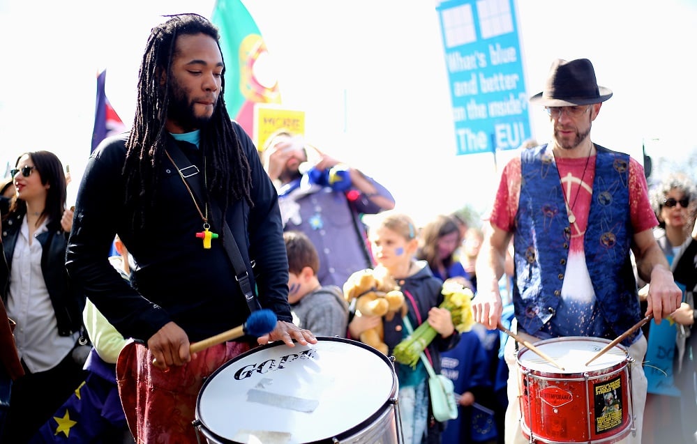 A photo of two men drumming at an anti-Brexit protest