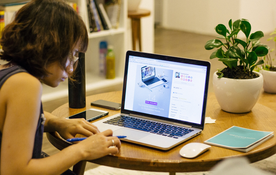 A woman working from home on her mac