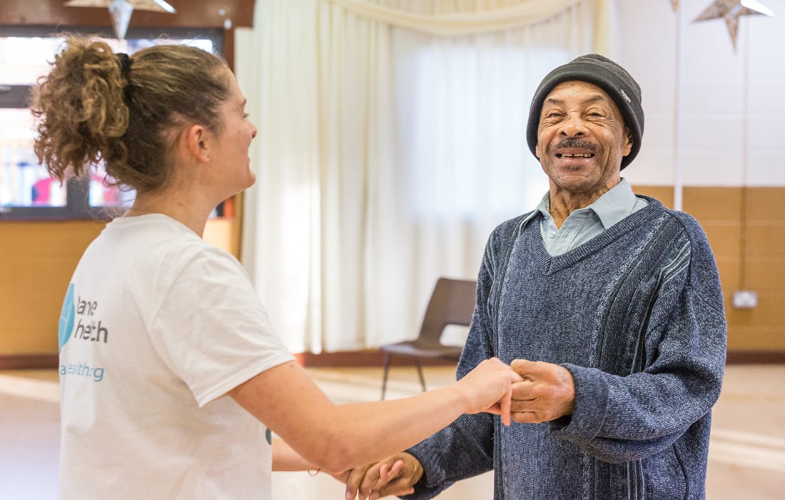 a younger female dancing with an older black gentleman