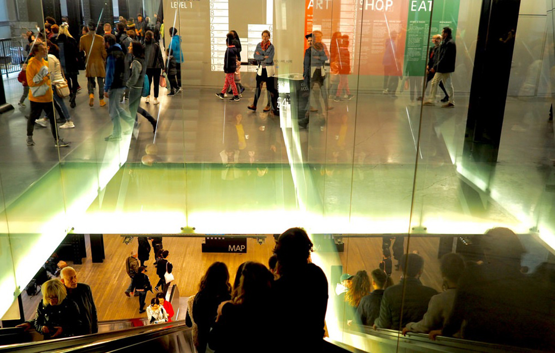 Visitors on an escalator at London's Tate Modern