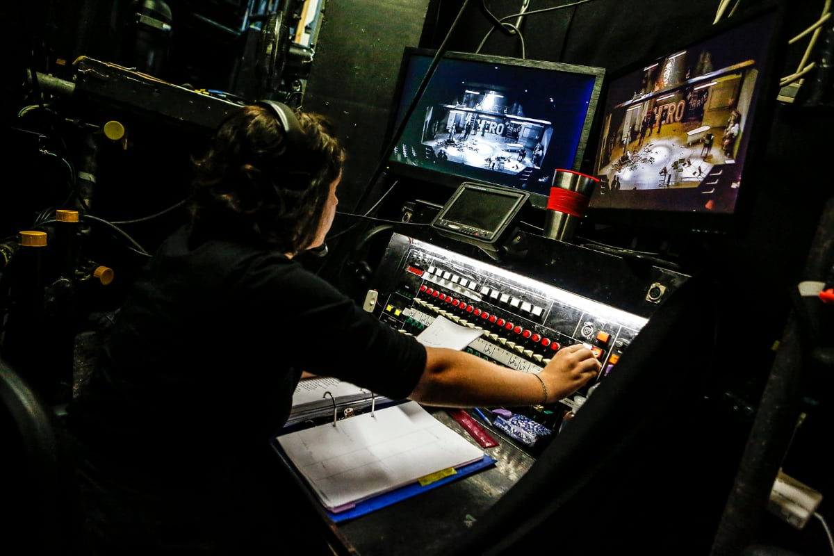 Someone operating a lighting board at the mercury theatre