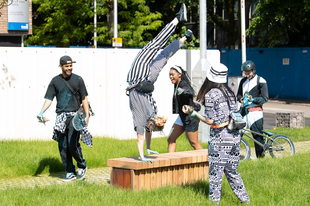 A group of young people dancing outside