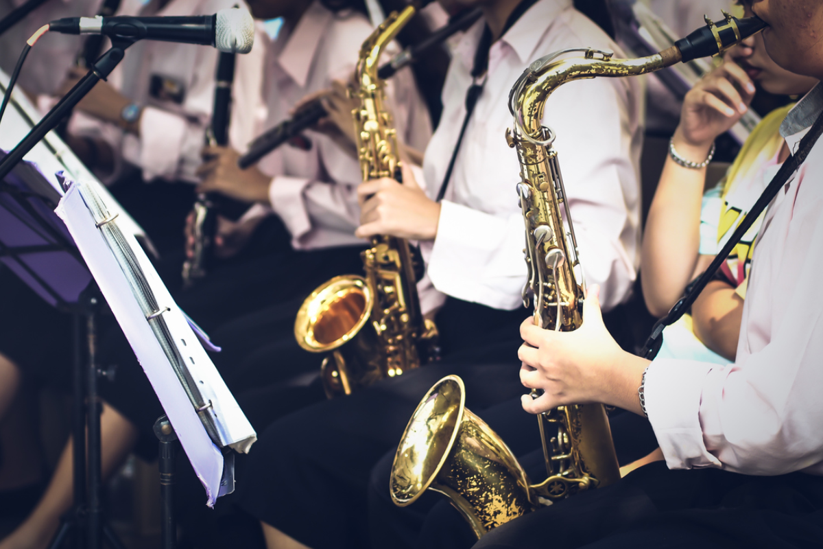 brass players play musical instrument