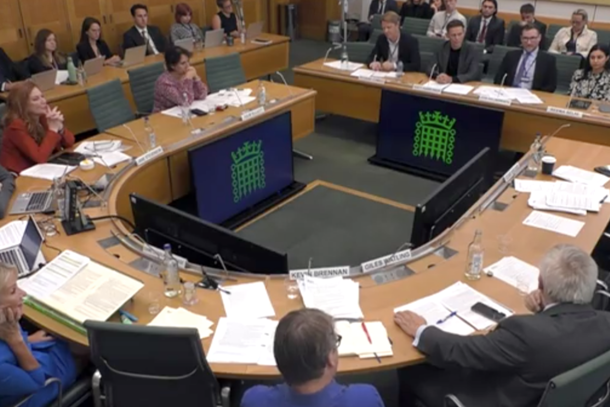 Image of parliamentary committee room with culture leaders giving evidence to MPs