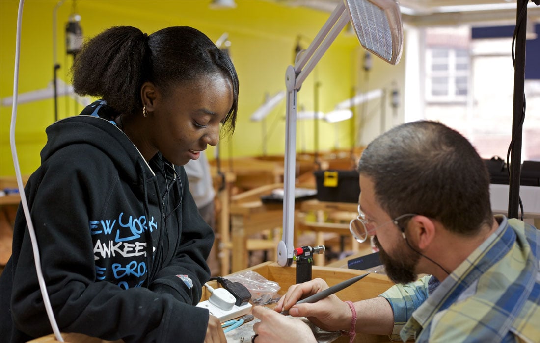 Girl learning on a craft apprenticeship