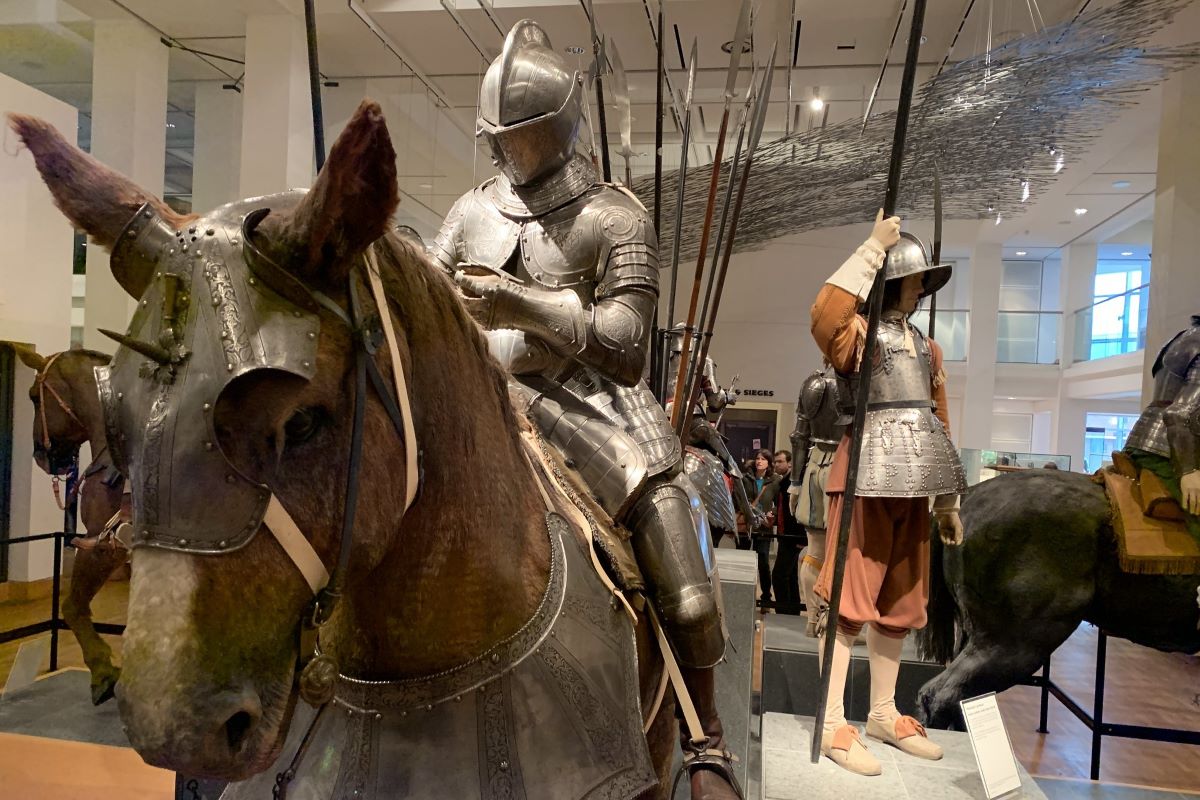 A mannequin in armour sitting on a fake horse at the Royal Armouries Museum, Leeds