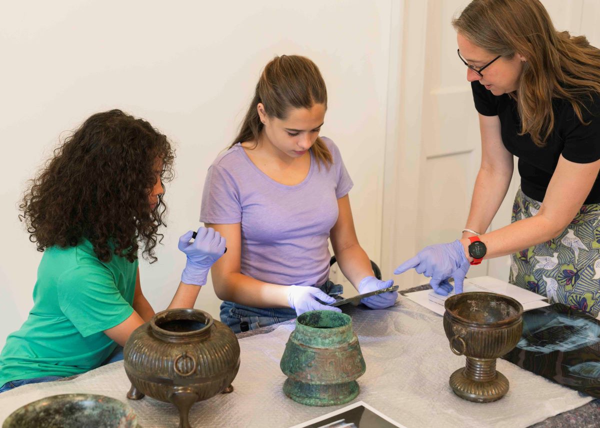 Young people with ceramic artefacts