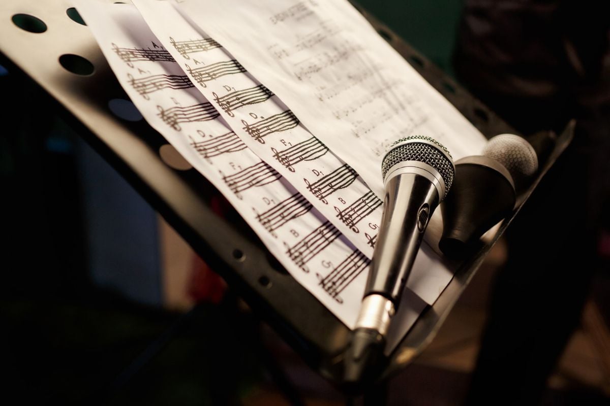 Microphones and music on a stand Maynagashev iStock